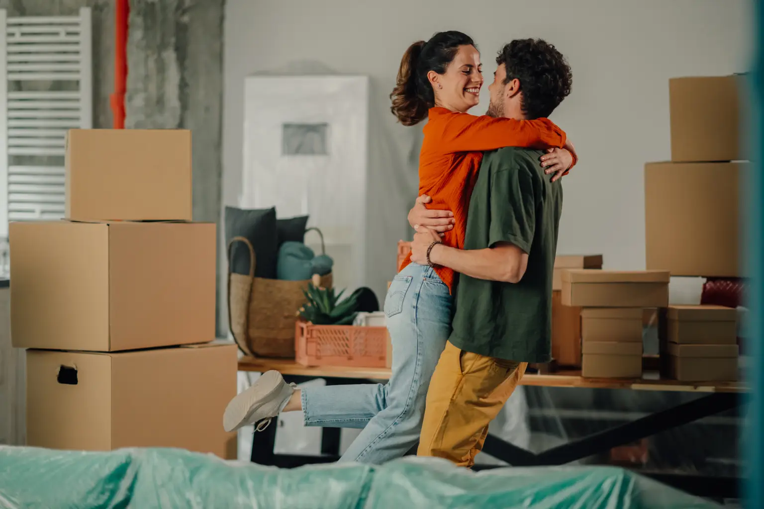 Couple celebrating after moving into a home